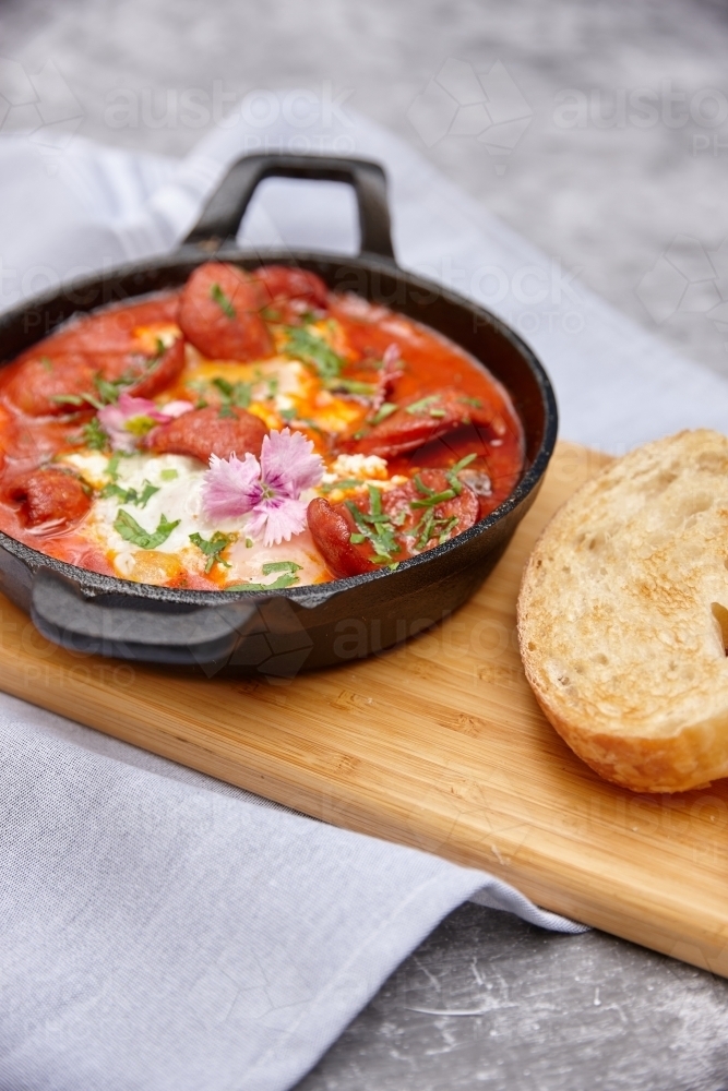 Breakfast dish of chorizo and egg with toast - Australian Stock Image