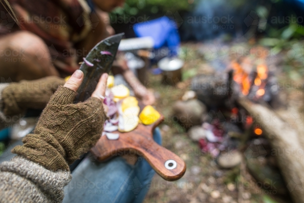 Breakfast preparations over a camp fire - Australian Stock Image