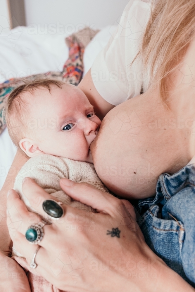 Breastfeeding baby. - Australian Stock Image