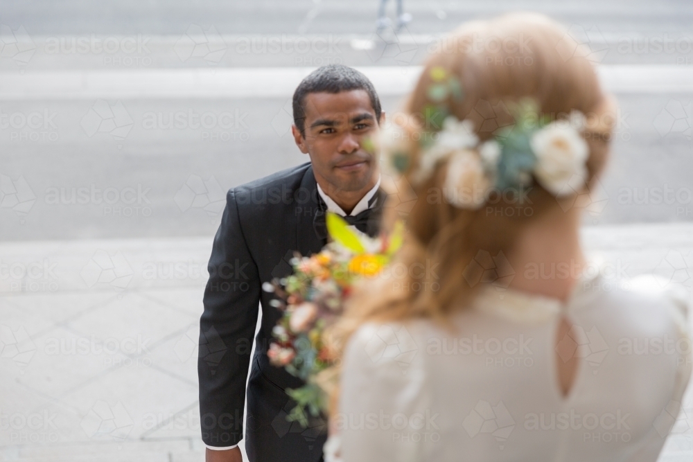 Bridal photos flowers in hair first look - Australian Stock Image