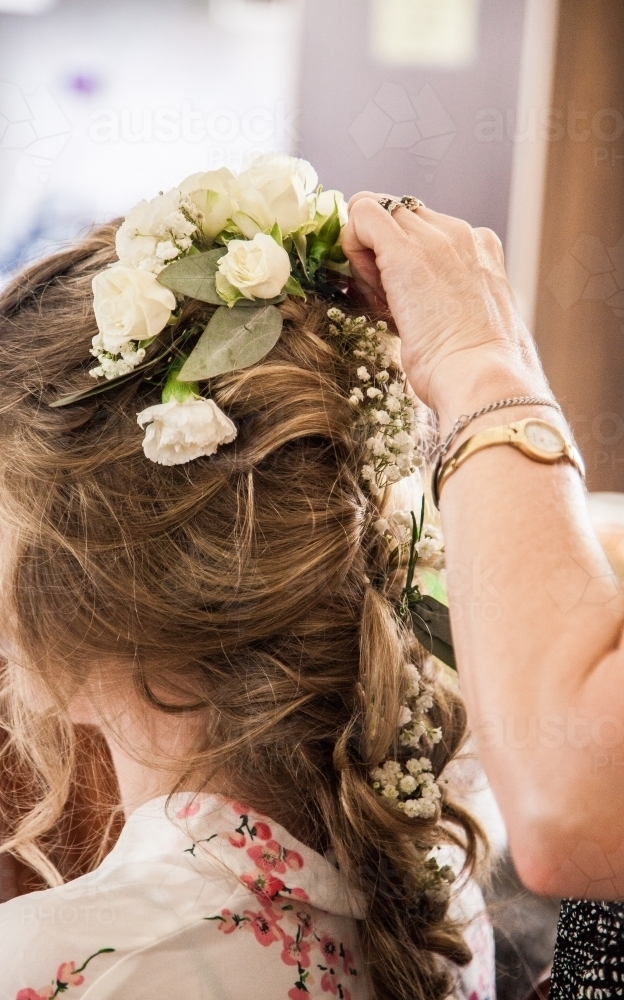 Bride getting her hair done before the wedding - Australian Stock Image
