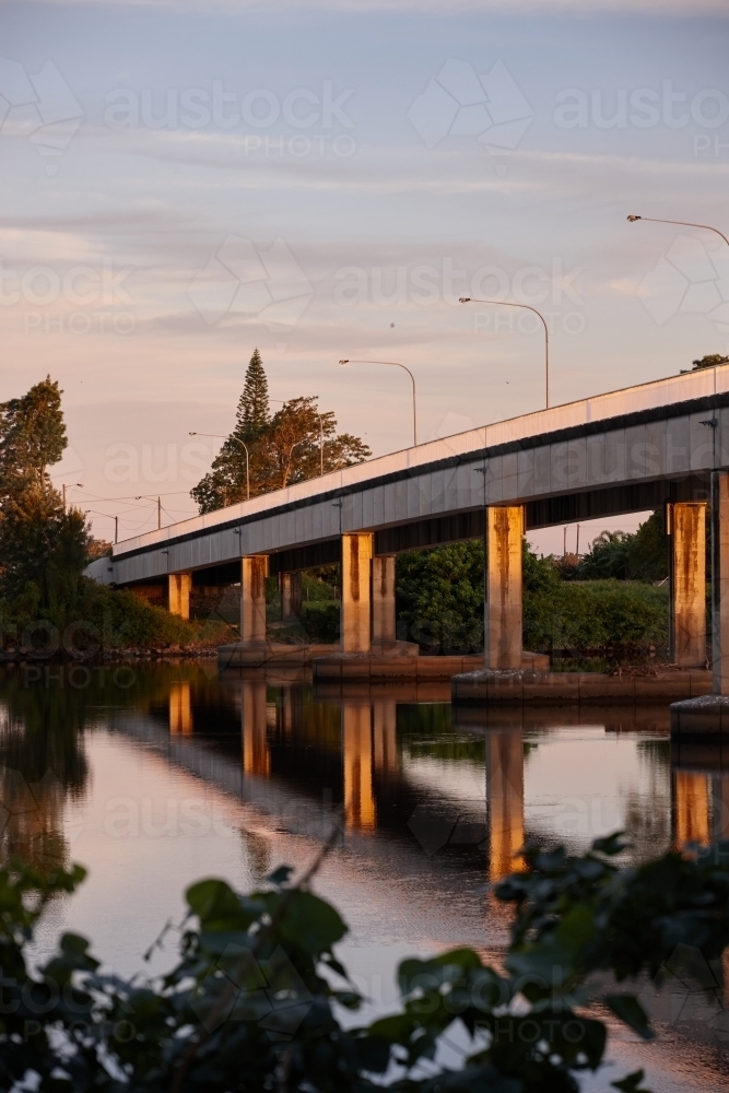 Bridge over river on dusk - Australian Stock Image
