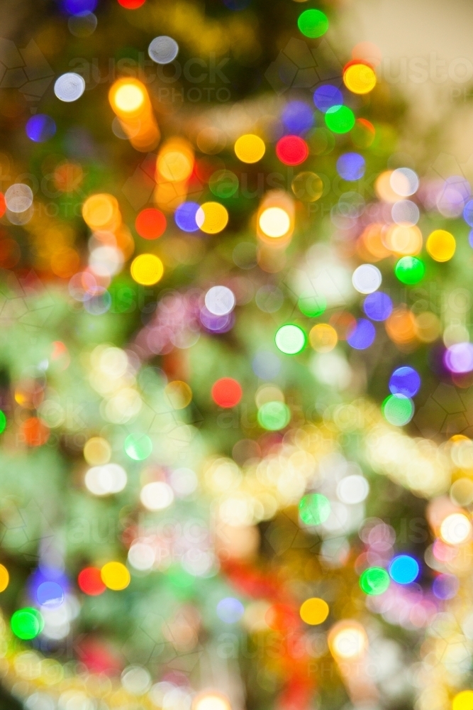 Image of Bright colourful bokeh Christmas lights - Austockphoto