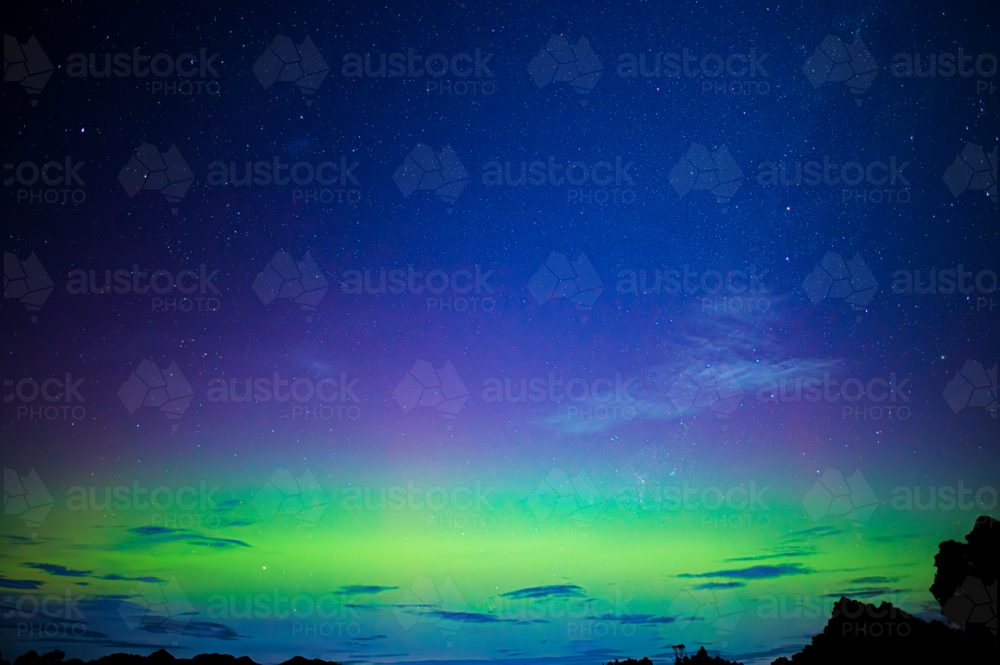 brilliant green aurora shimmering in night sky - Australian Stock Image