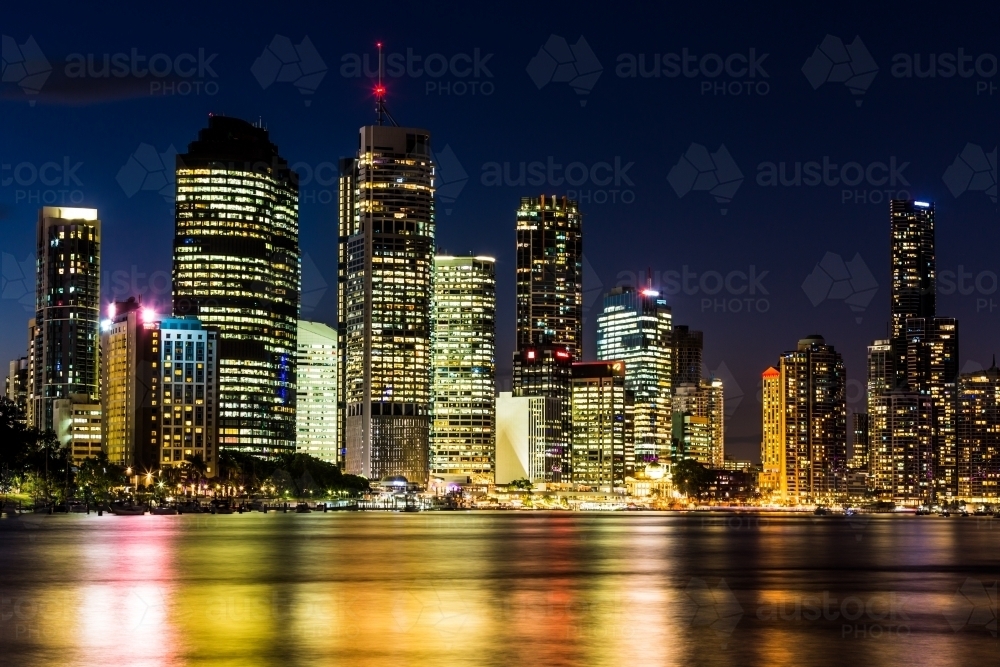Brisbane CBD lights reflected on water at night - Australian Stock Image