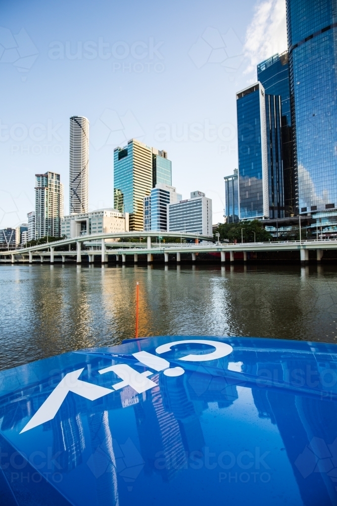 Brisbane City Cat travelling upstream along the Brisbane River in the city - Australian Stock Image