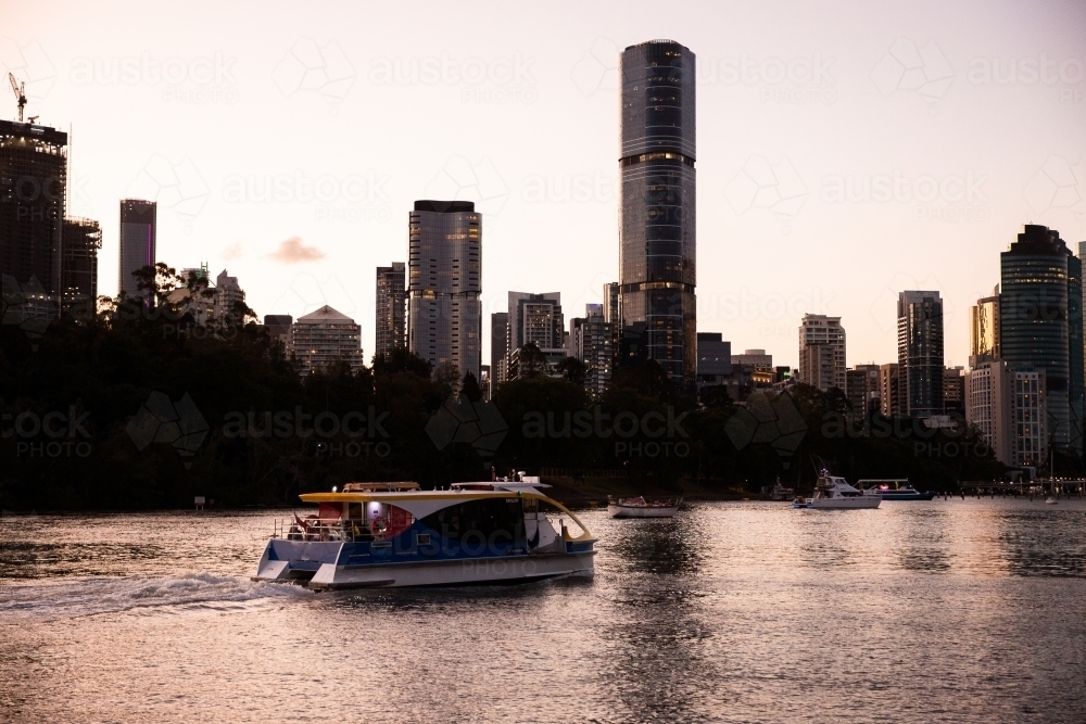 Brisbane city ferry on the river at dusk - Australian Stock Image