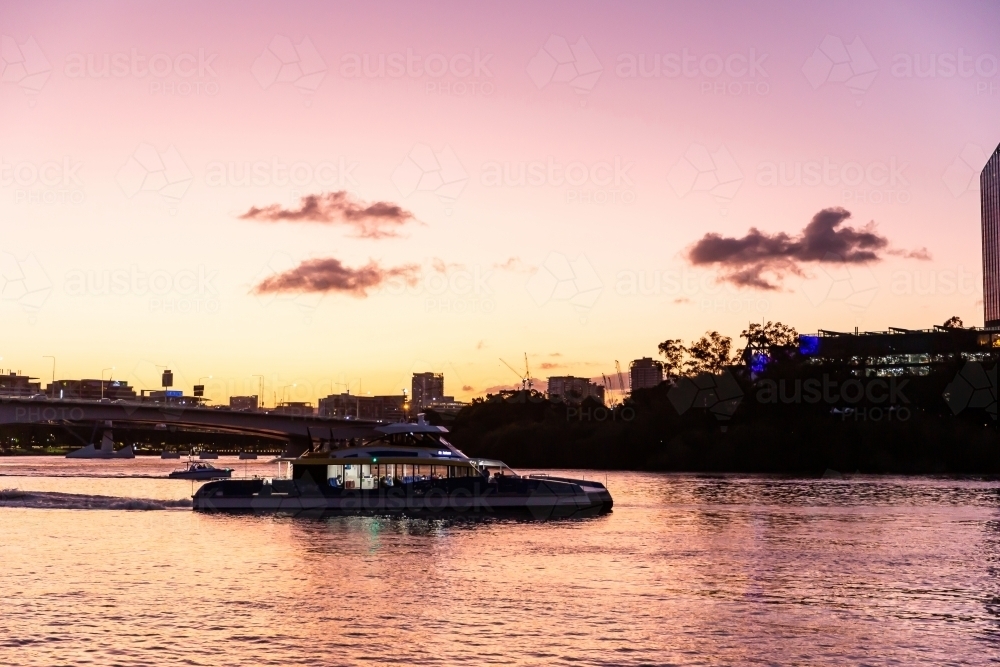 Image of Brisbane river boats at sunset Austockphoto