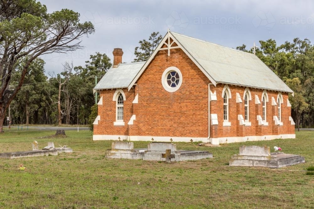 Broke Fordwich Country Church with graves behind - Australian Stock Image