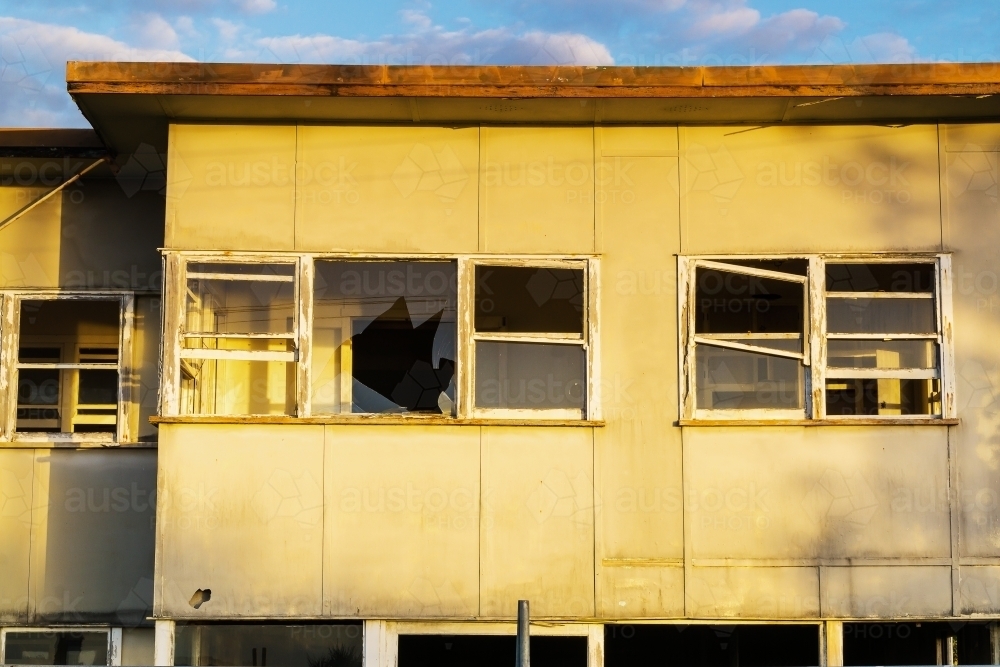 Broken windows in a derelict house - Australian Stock Image