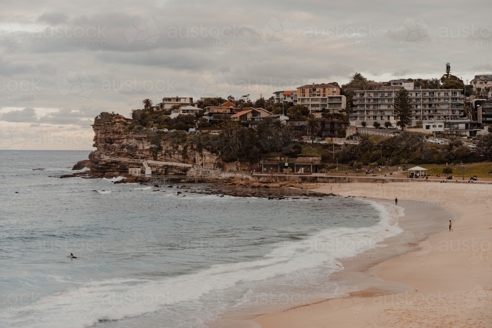 Bronte Beach and headland on a calm afternoon. - Australian Stock Image