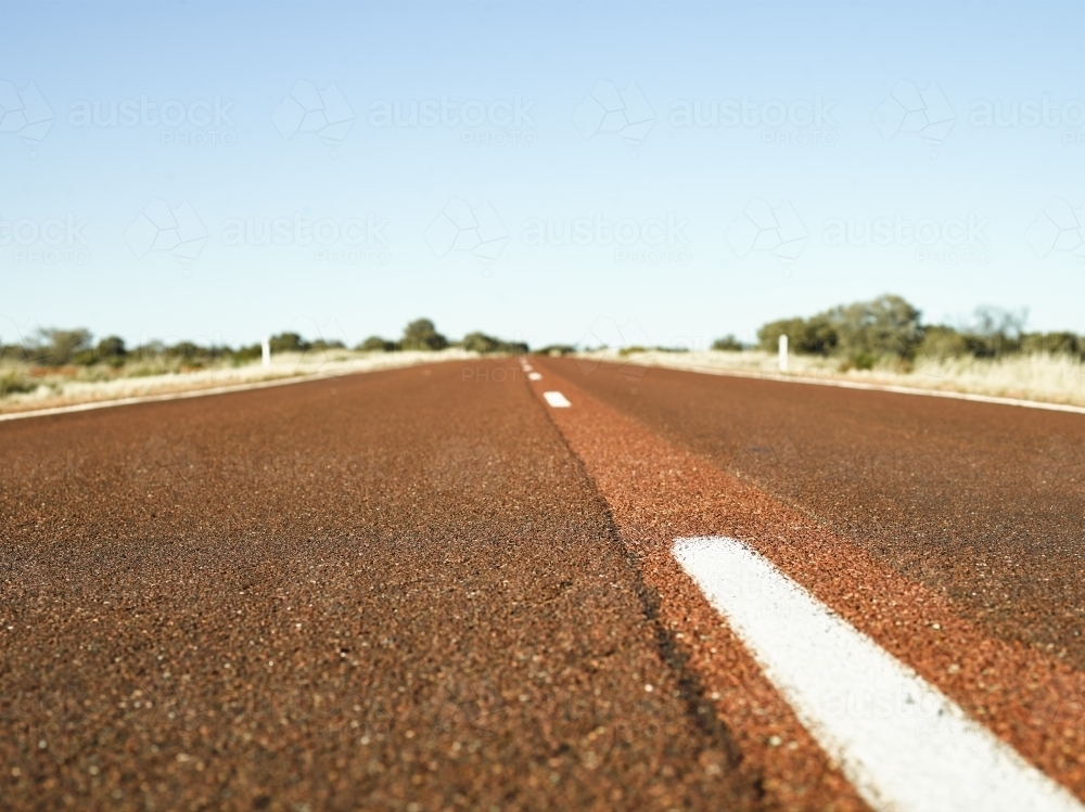 Brown bitumen highway in outback - Australian Stock Image
