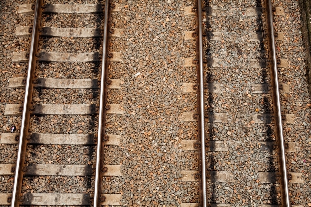 Brown railway tracks and gravel with sleepers and rails - Australian Stock Image