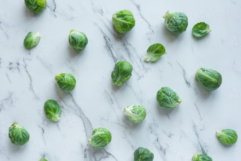 brussels sprouts on a marble background - Australian Stock Image