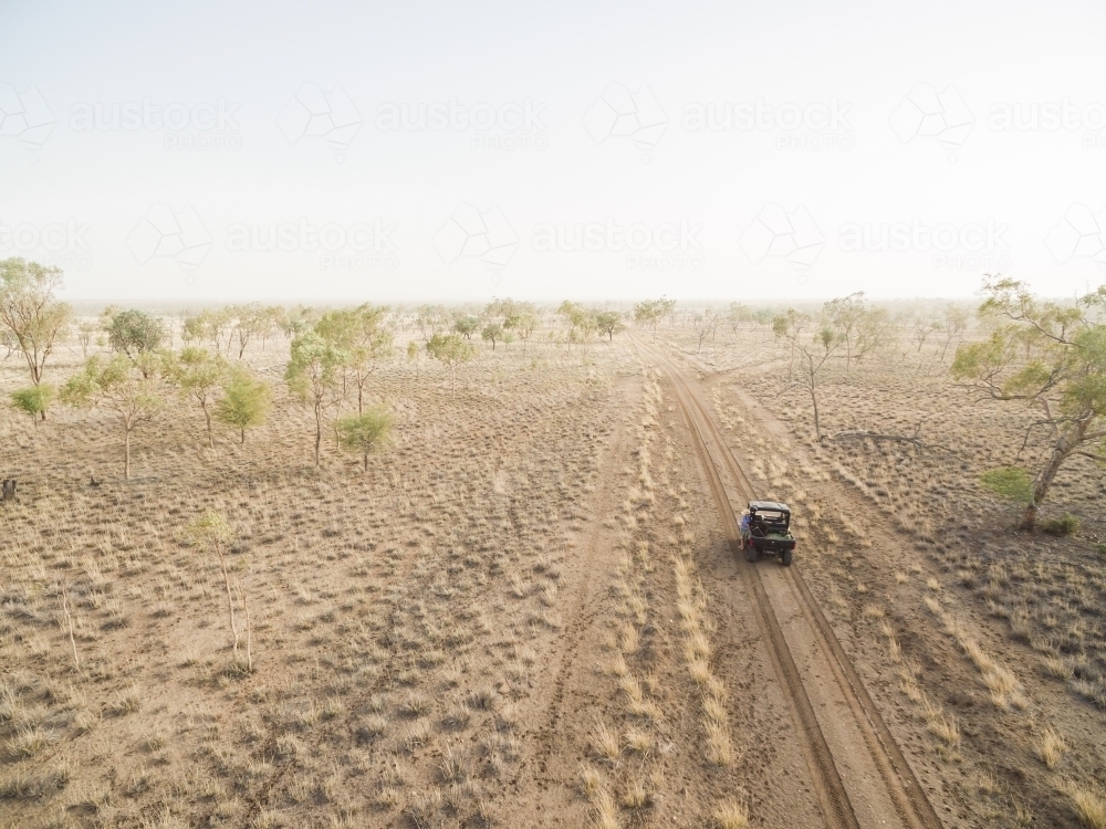 Buggy driving along road in outback - Australian Stock Image