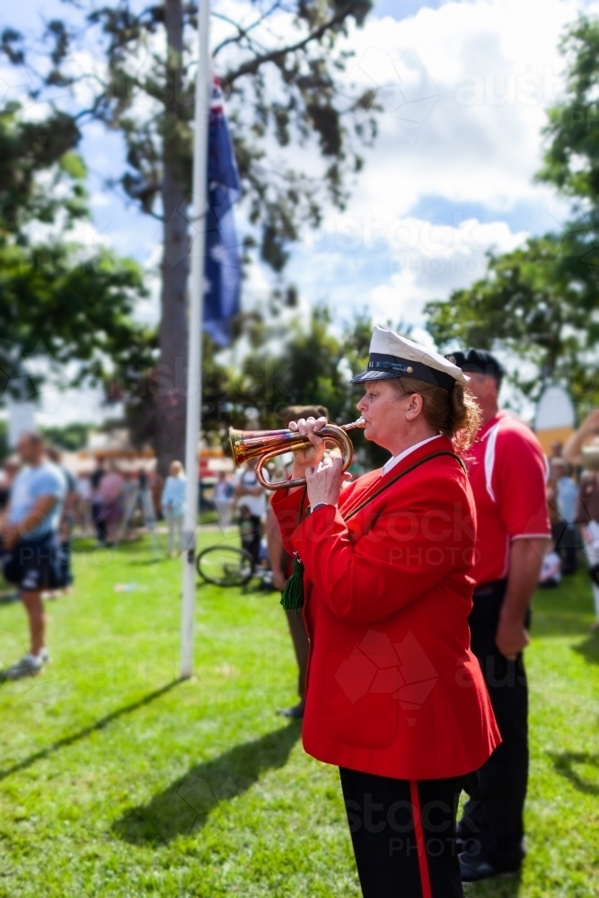 Image of Bugle player playing at ANZAC day memorial service - Austockphoto