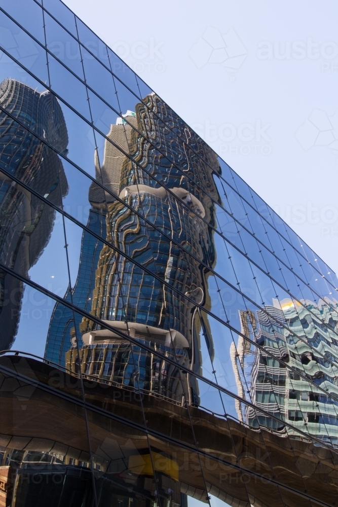 Buildings reflected in modern glass facade - Australian Stock Image