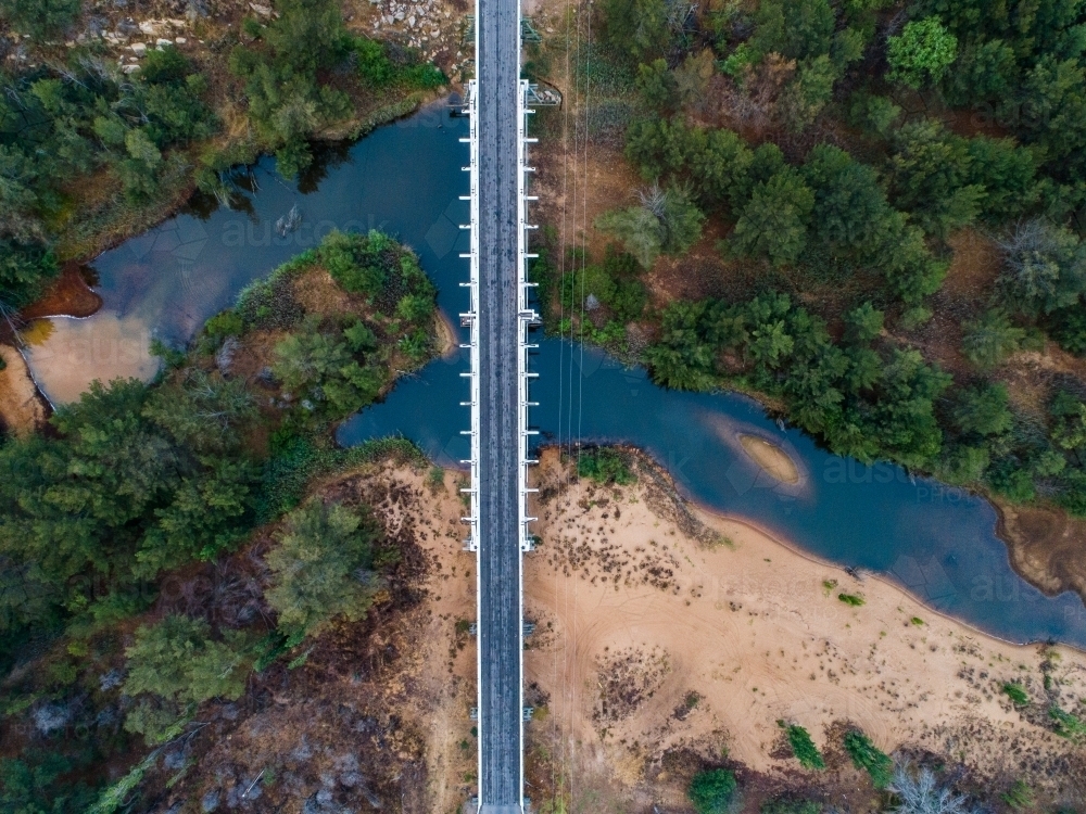 Bulga bridge over stagnant creek on overcast day - Australian Stock Image
