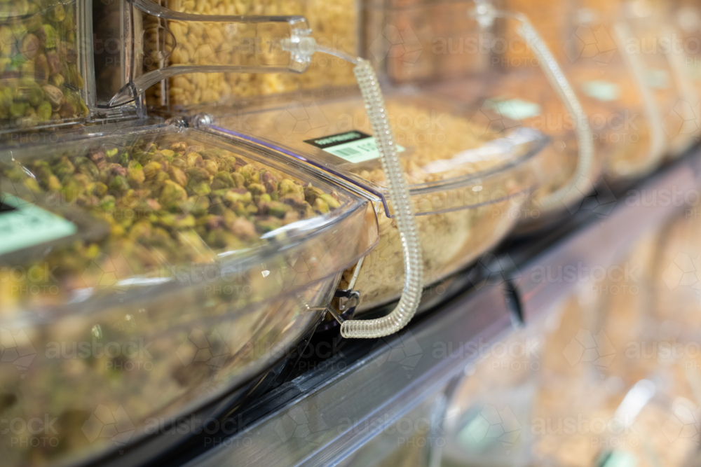 bulk food containers with nuts - Australian Stock Image