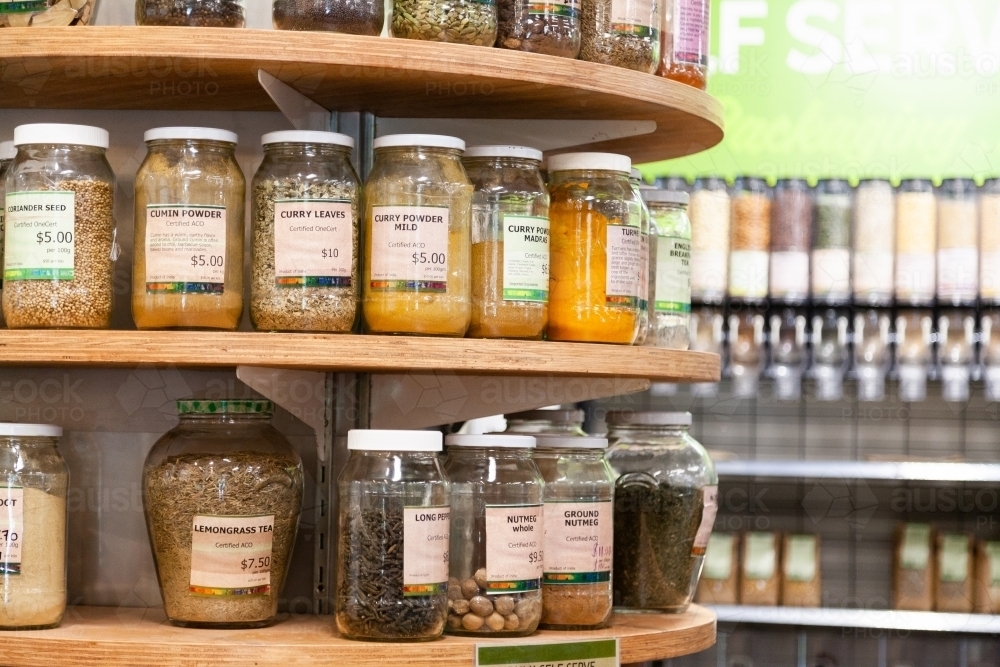 Bulk jars of spices in organic store - Australian Stock Image