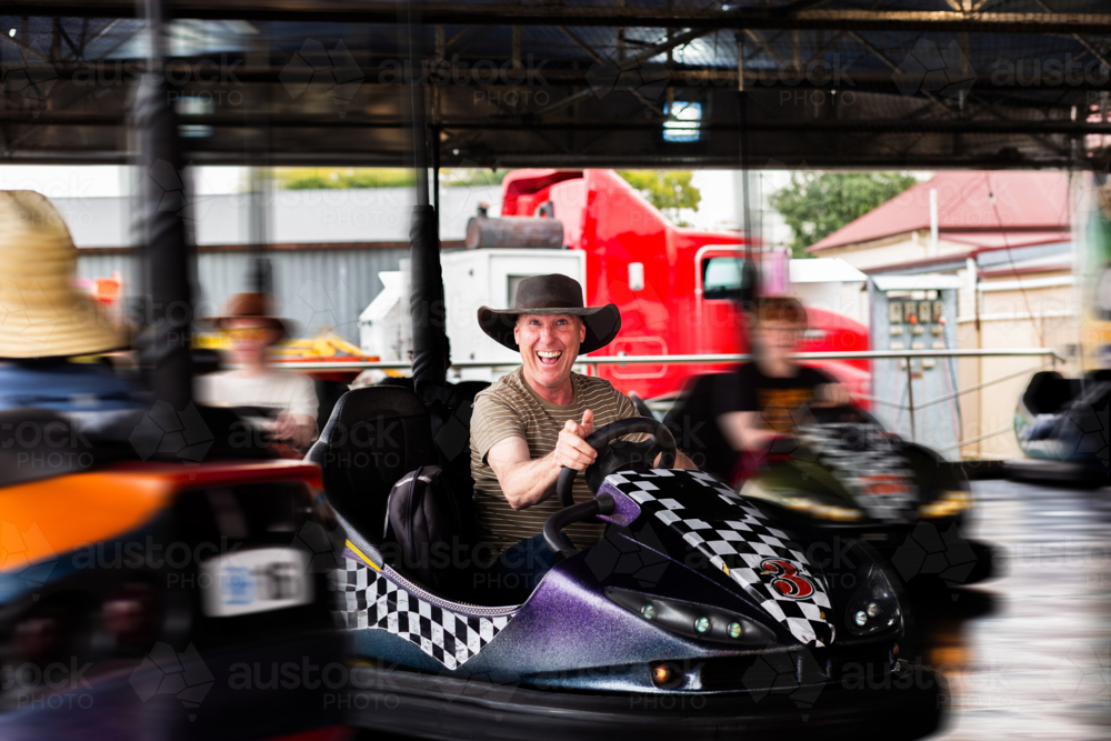 Image of Bumper cars ride with Aussie man riding dodgem car at carnival ...