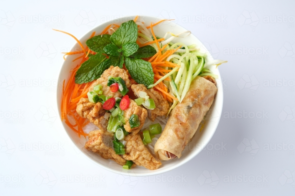 Image of Bun Cha Gio bowl topped with fried spring roll and Cha Lua ...