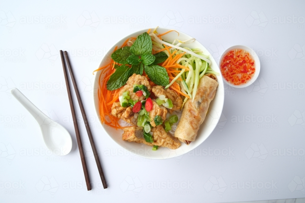 Image of Bun Cha Gio bowl topped with fried spring roll and Cha Lua ...