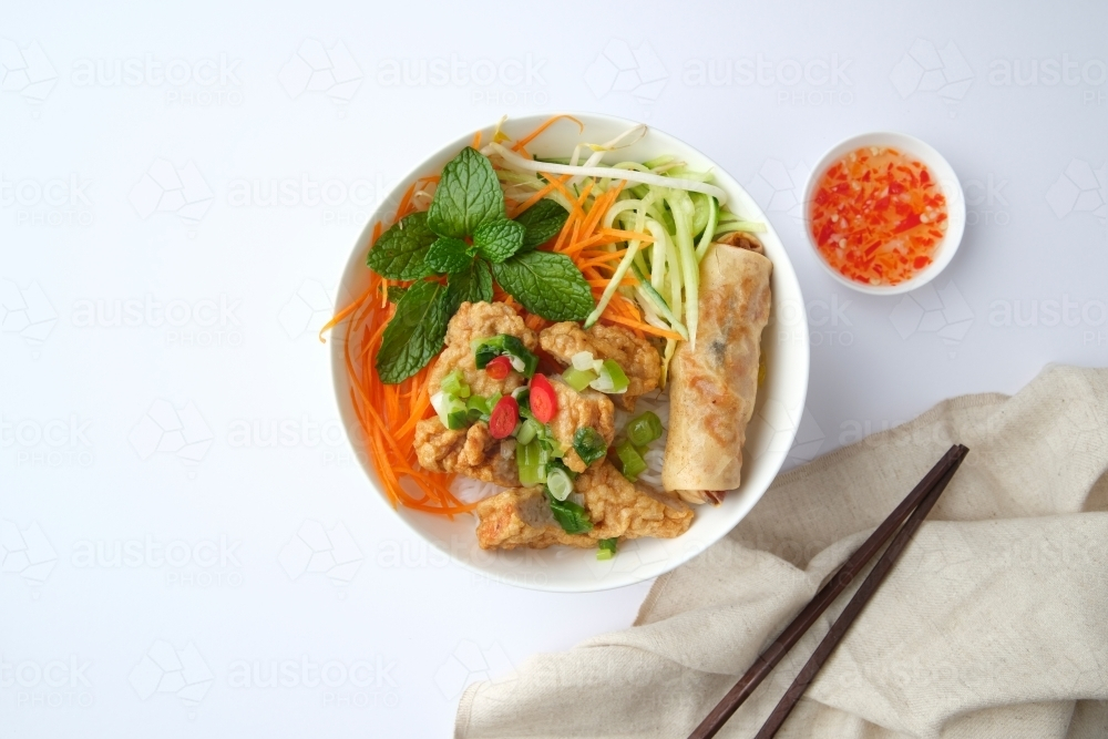 Image of Bun Cha Gio bowl topped with fried spring roll and Cha Lua ...