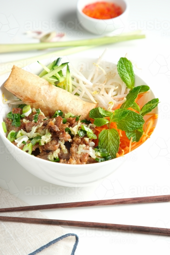 Bun Cha Gio bowl with meat slices topped with fried spring roll. - Australian Stock Image