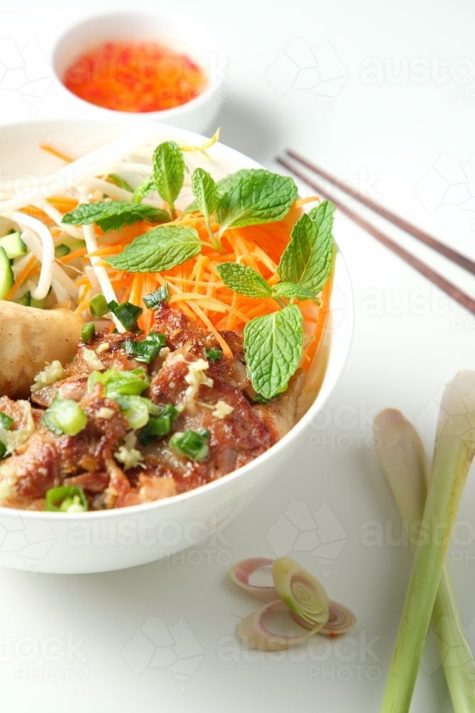 Bun Cha Gio bowl with meat slices topped with fried spring roll. - Australian Stock Image