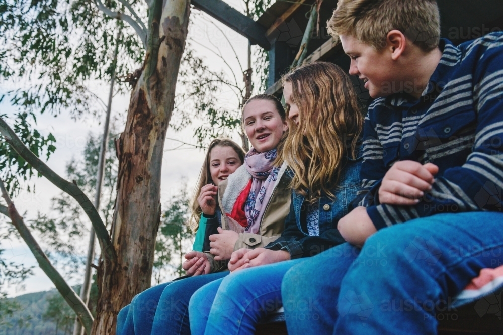 bunch of teens hanging out in the woods - Australian Stock Image