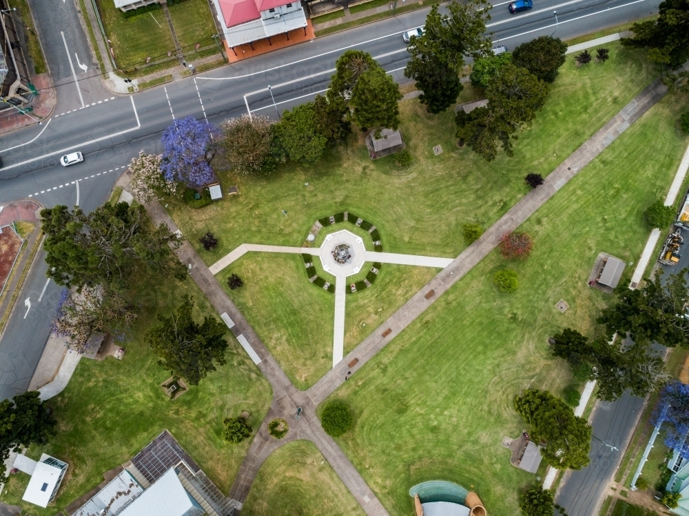 Burdekin Park cenotaph with remembrance day wreaths laid around it seen from aerial view - Australian Stock Image