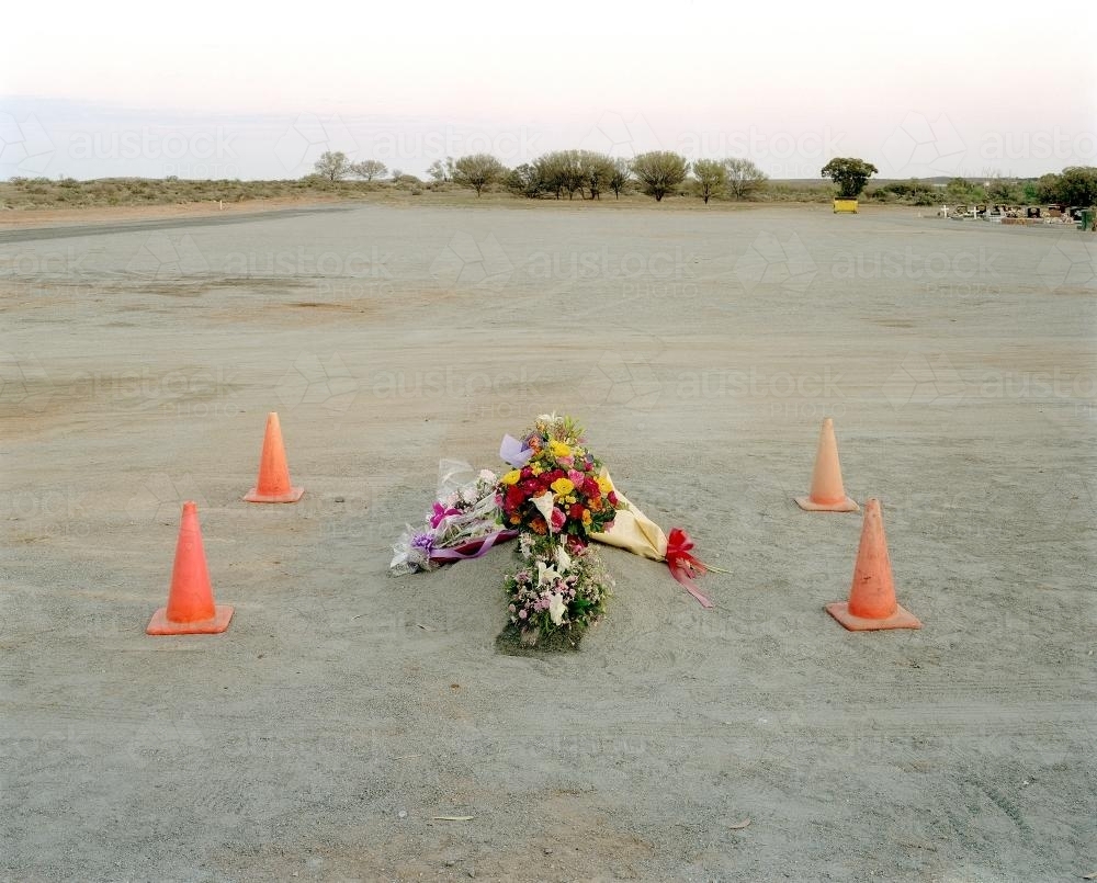 Burial site in remote town with flowers - Australian Stock Image