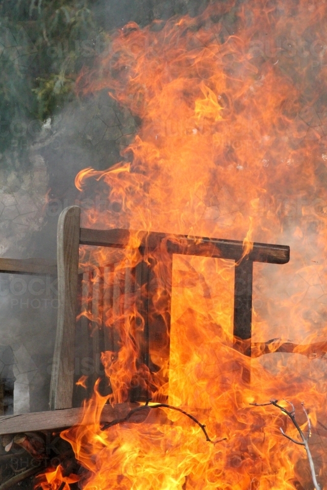 Burning chair on bonfire - Australian Stock Image