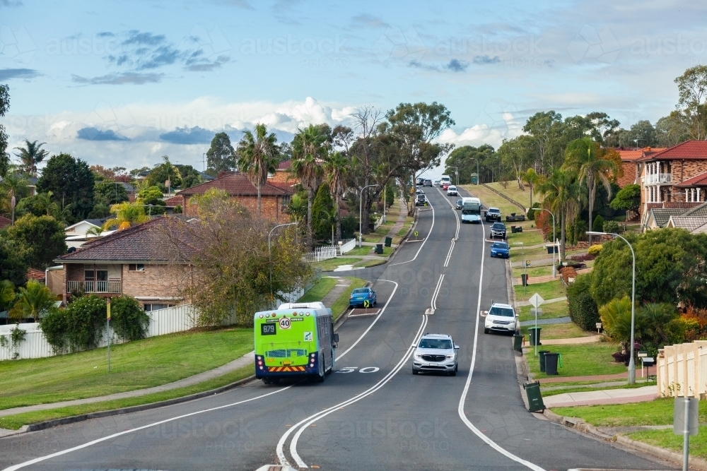 Bus pulling over at bus stop in Greater Western Sydney, NSW - Australian Stock Image