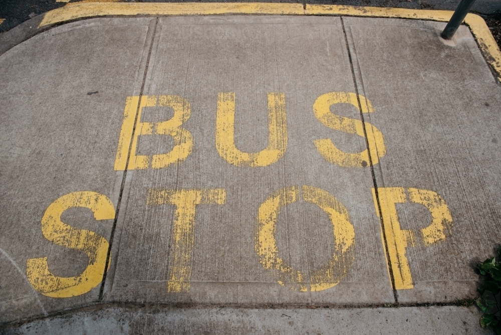 Bus Stop sign painted on pavement - Australian Stock Image