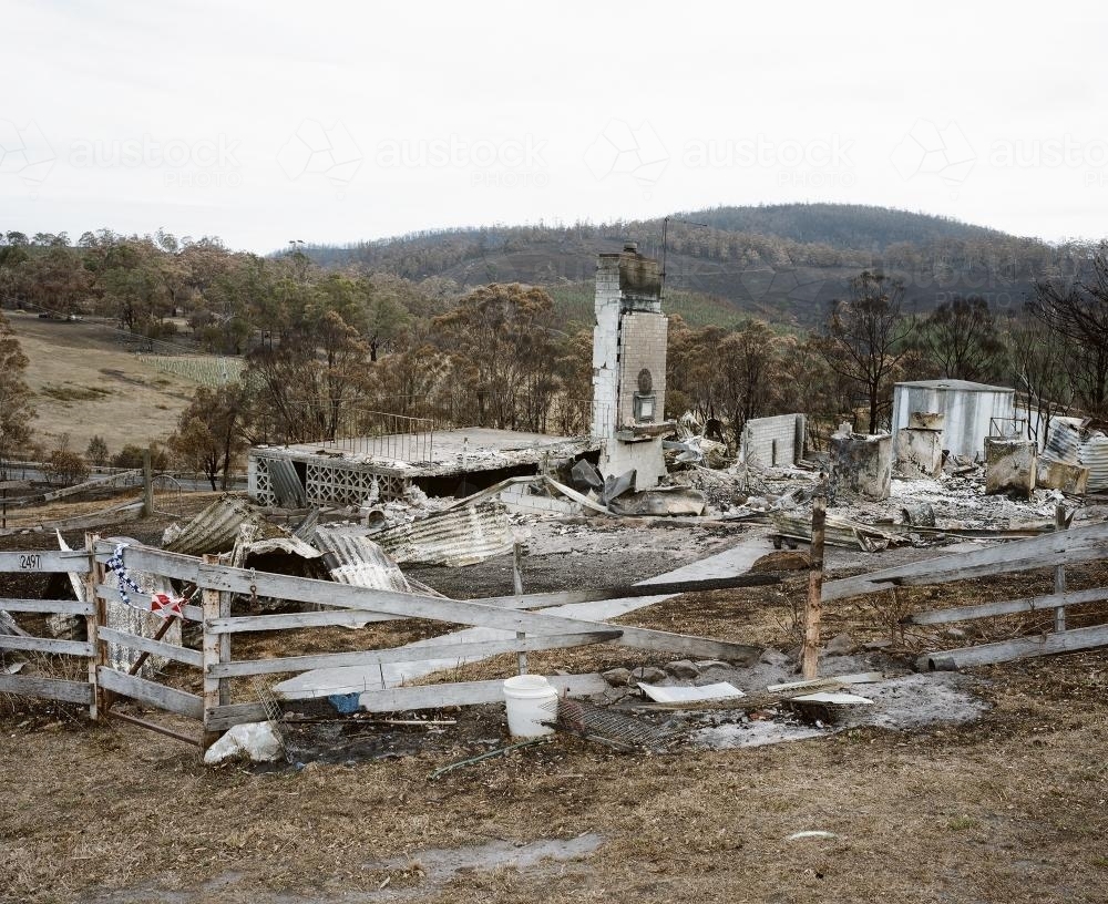 Bushfire ravaged landscape with destroyed country house - Australian Stock Image