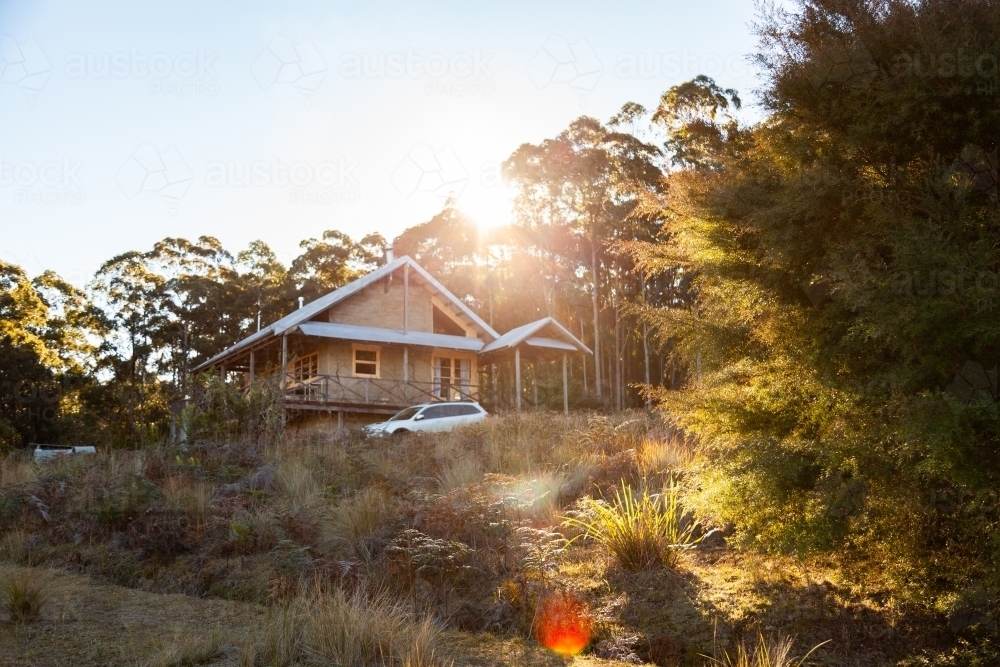 Cabin in the woods with car beside it on rural property in the hunter valley hills - Australian Stock Image