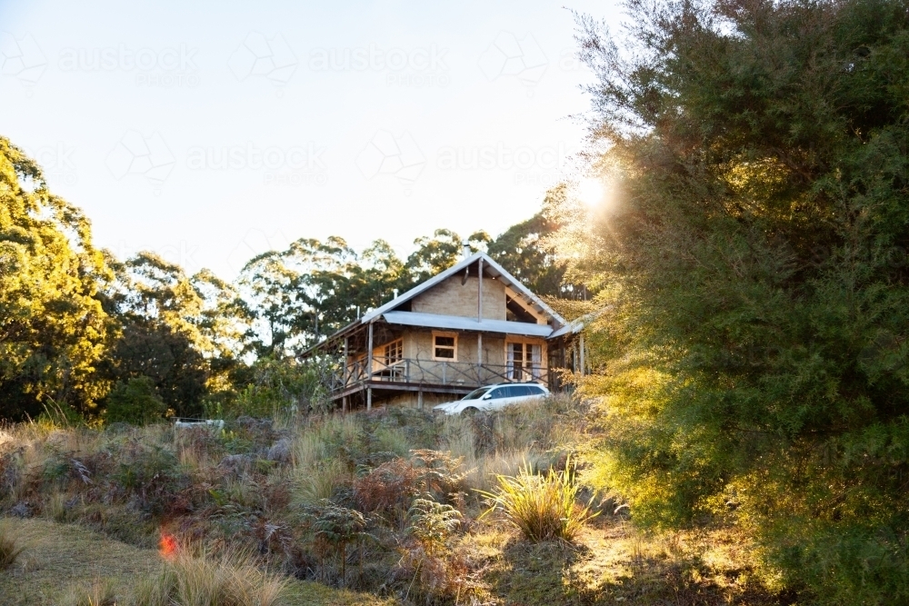 Cabin in the woods with car beside it on rural property in the hunter valley hills - Australian Stock Image
