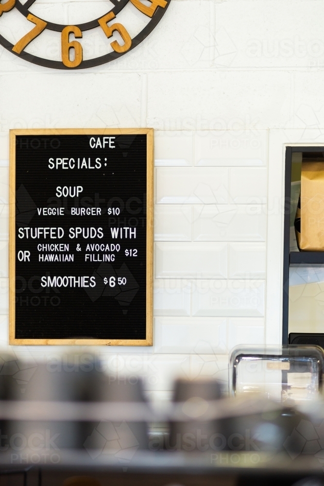 Café menu sign on wall showing specials - Australian Stock Image