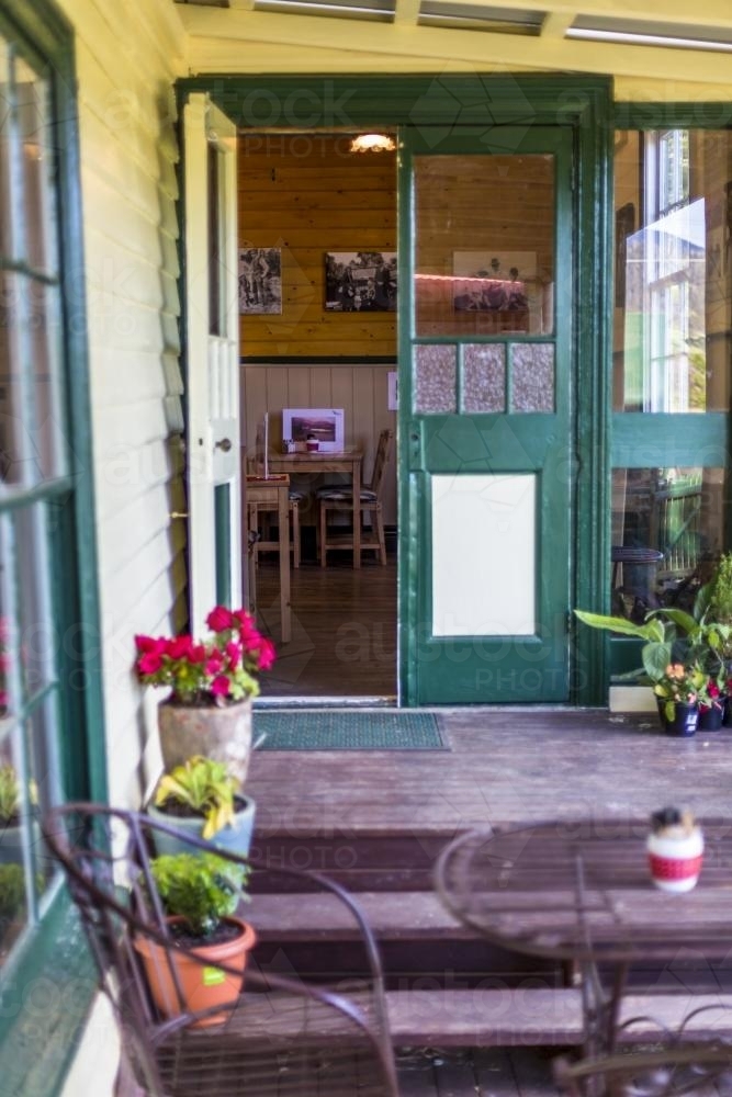 Cafe entrance with steps and open door - Australian Stock Image