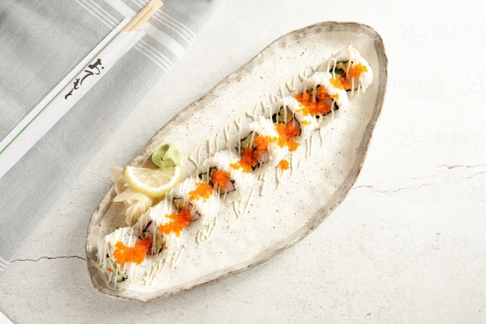 California sushi rolls on ceramic plate - Australian Stock Image
