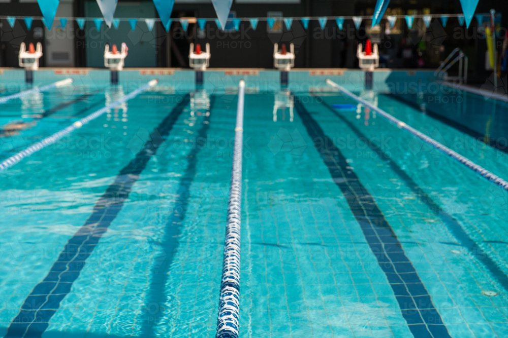 calm and still water in a 25 metre public swimming pool - Australian Stock Image