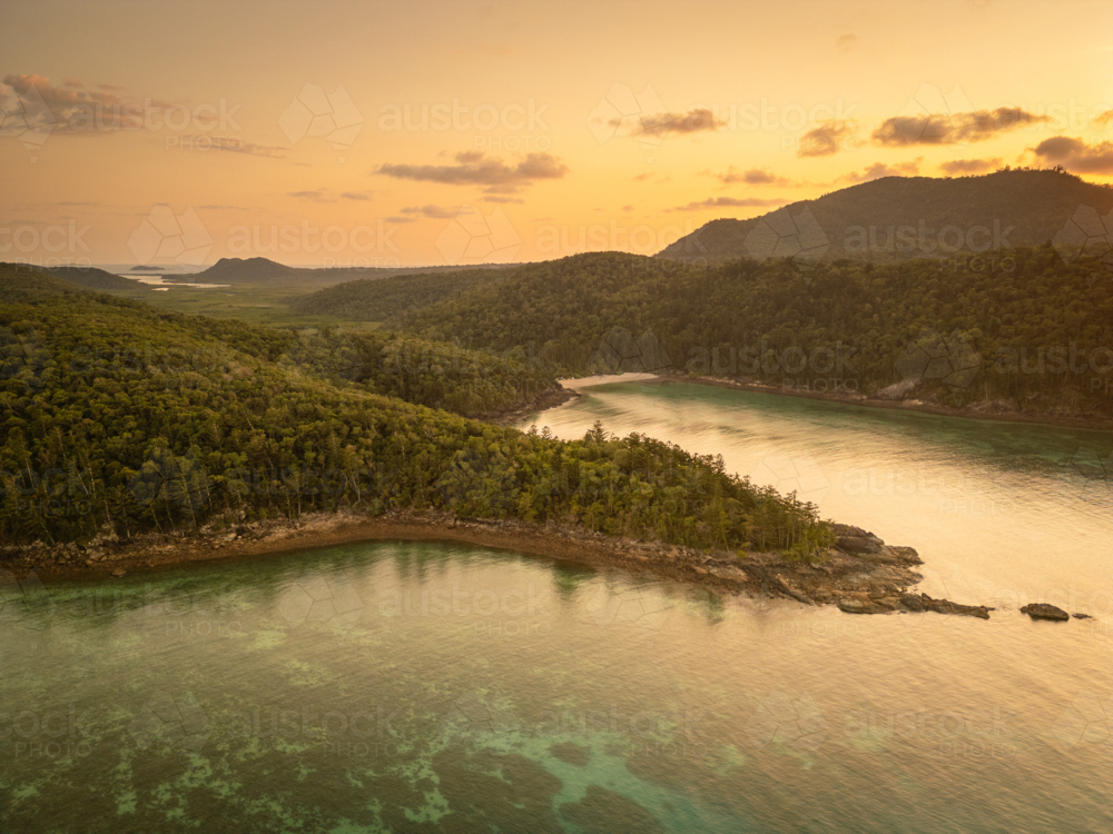 calm ocean water and hilly outcrops of islands - Australian Stock Image