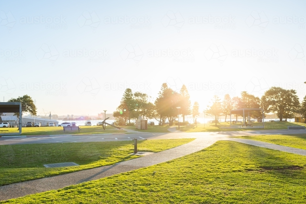 Camp Shortland at Nobbys Beach with golden sunset light - Australian Stock Image