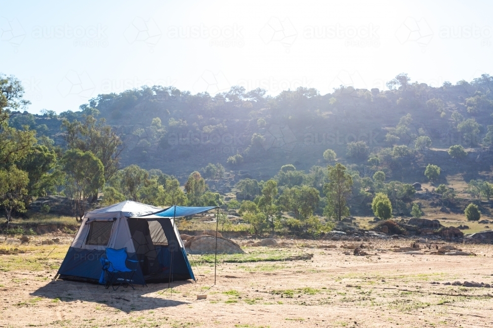 Camping holiday tent and chair at wyangala dam - Australian Stock Image