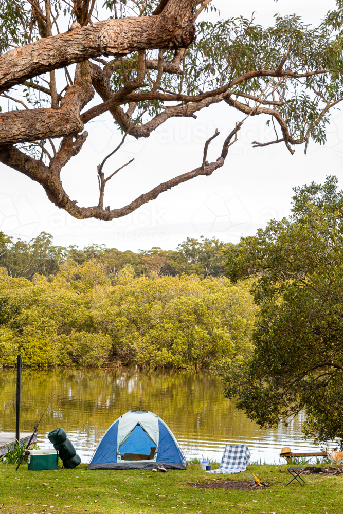 Camping tents built beside the lake - Australian Stock Image