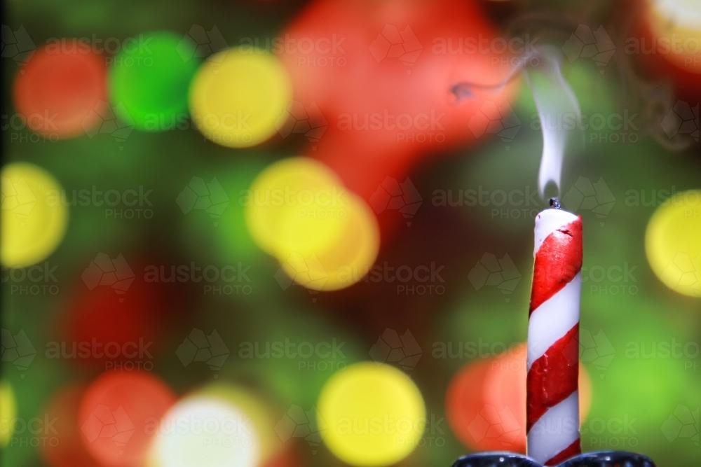 Candle smoking after being blown out - Australian Stock Image