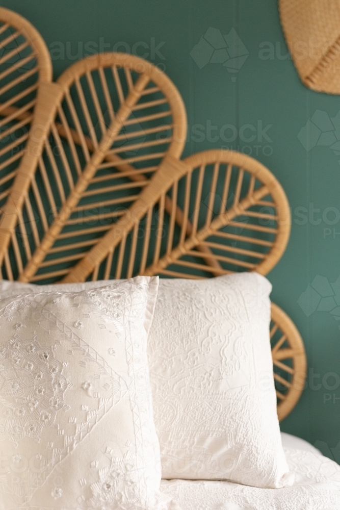 Image of Cane bed head and pillows close up Austockphoto