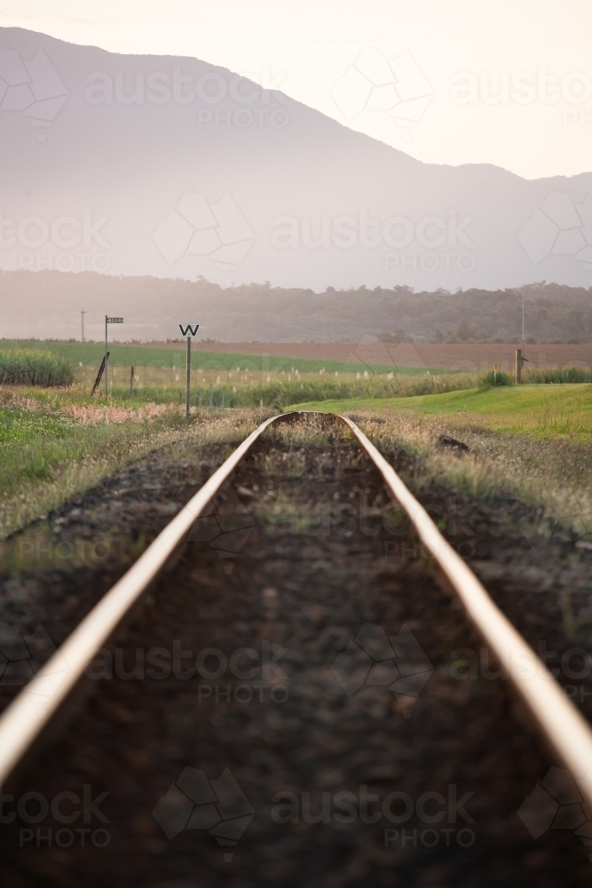 Cane train tracks with mountains in background - Australian Stock Image